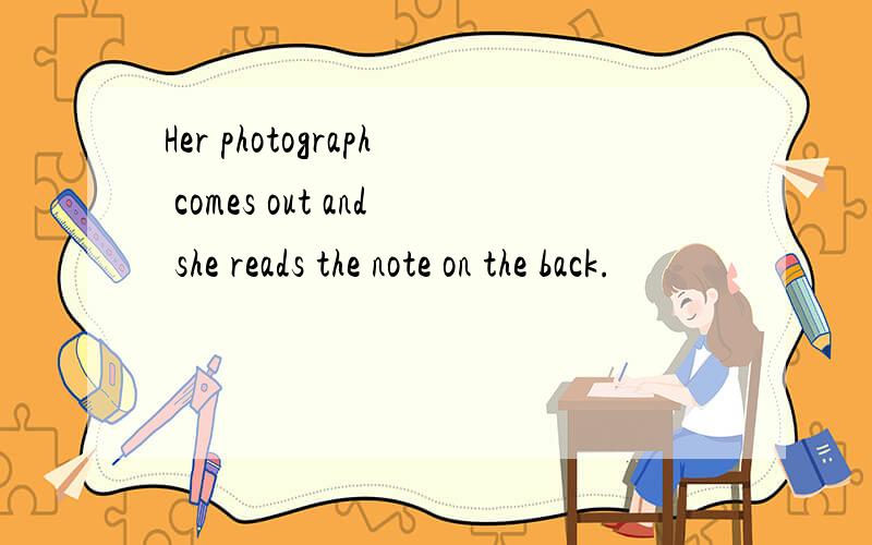 Her photograph comes out and she reads the note on the back.